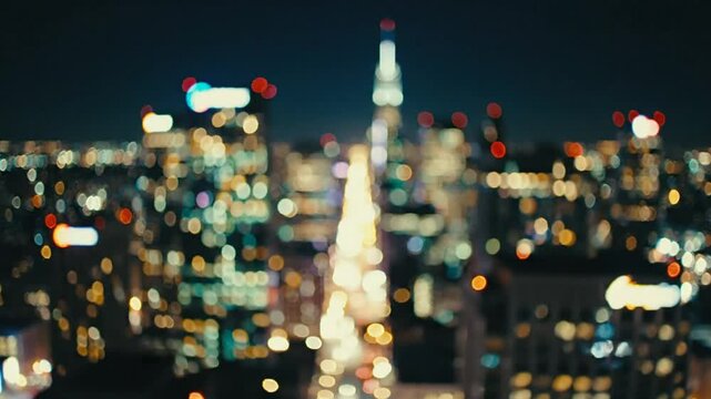 Blurred city lights nightscape of Manhattan skyline with central avenue illuminating the cityscape