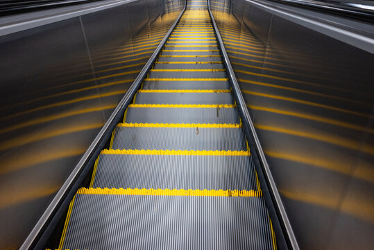 Escalator moving down at subway station