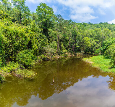 A view up the Thu Bon River from the pedestrian bridge leading into the My Son Sanctuary in Quang Nam Province, Vietnam on a bright sunny day