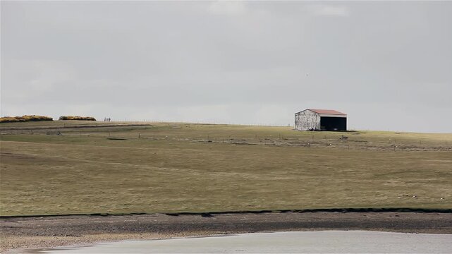 Remote Shed In Open Field Of Goose Green Falkland Islands (Islas Malvinas) - 4K