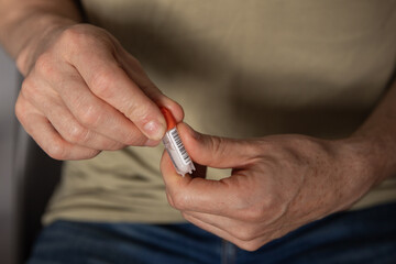 Hands holding a sample tube prepared for DNA testing, illustrating a convenient way to explore...