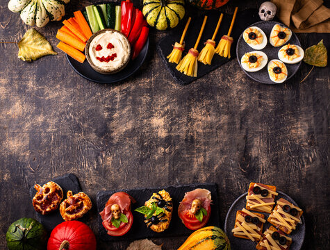 Halloween appetizers with pumpkin hummus deviled eggs and mummy snacks