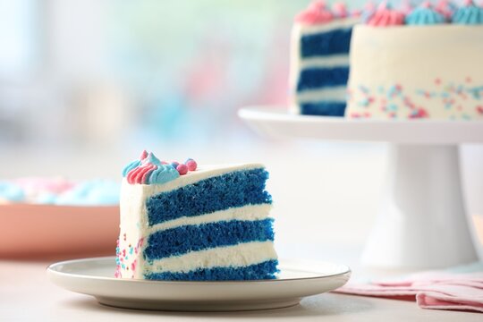 Slice of gender reveal cake with blue layers on white table, closeup. Space for text