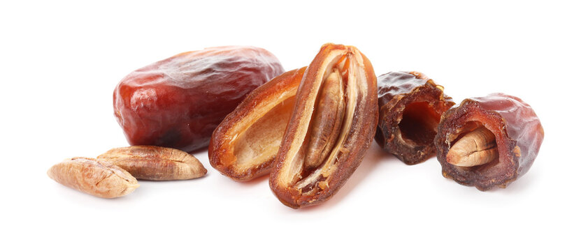 Whole and cut dried date isolated on white