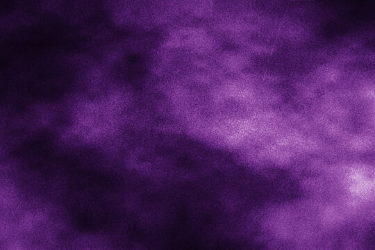Abstract dark purple grunge textured surface background with light scratches and dust for design elements or overlay effects.