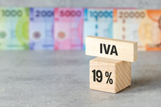 Tax reform concept in Chile showing value added tax reduction with text IVA 19 percent on wooden blocks. Financial and business background