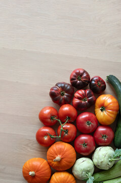 Various vegetables on wooden table background flat lay with copy space and natural light, top view, lifestyle