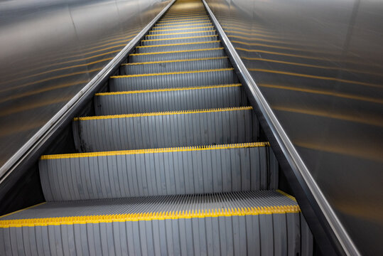 Escalator moving down at subway station