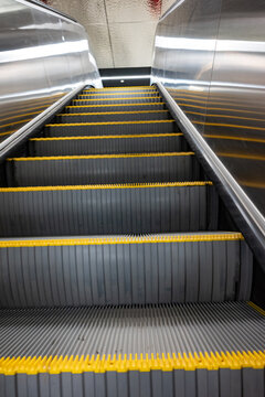 Escalator moving down at subway station