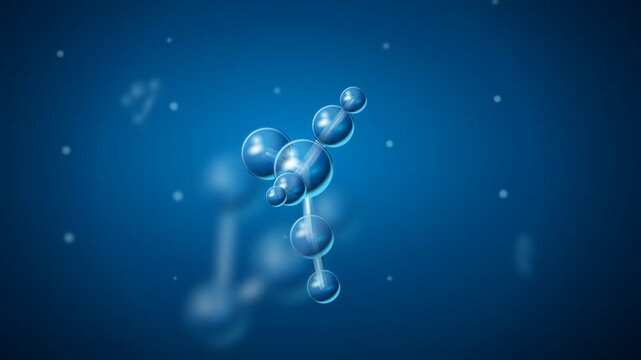 Blue glass molecule model rotating on dark background