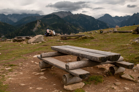 Rustic wooden picnic table on a scenic mountain meadow in the Tatra National Park of Poland