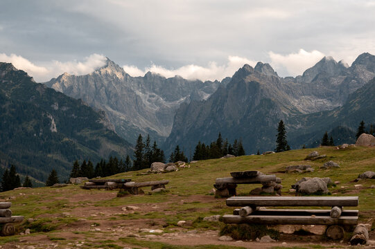 Scenic view of the majestic Tatra Mountains peaks from the grassy Rusinowa Polana in Poland