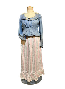 Antique folk-style two-piece outfit featuring a blue textured bodice with a wide collar and a long, pink-and-white striped skirt with a ruffled hem.