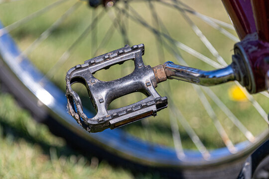 Close-up of bicycle pedal and crank arm