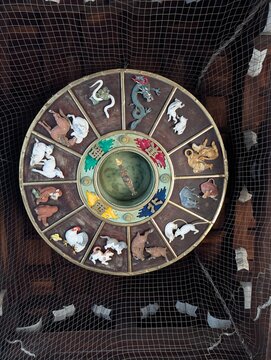Carved Wooden Eto Zodiac Calendar Wheel on Romon Gate Ceiling at Kushida Shrine in Fukuoka Japan