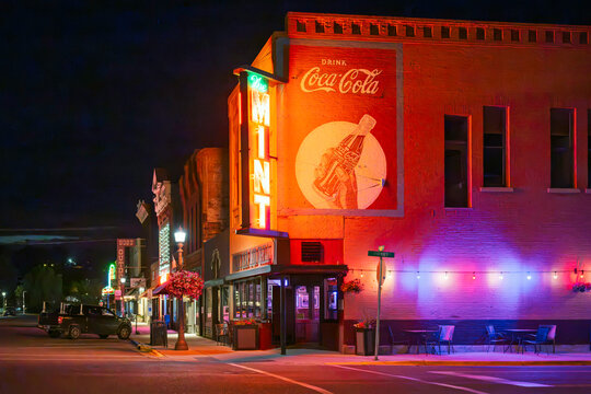 Night view of the iconic neon sign of The Mint Bar and Grill, a historic tavern that holds the oldest liquor license in Montana, on Main Street in Livingston, Montana, July 29 2026.