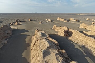 Yadan National Geopark near Dunhuang, Gansu, China, features dramatic wind-eroded rock formations rising from the Gobi Desert. A striking landscape along the ancient Silk Road. © JEREMIE