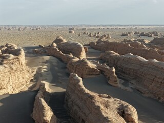 Yadan National Geopark near Dunhuang, Gansu, China, features dramatic wind-eroded rock formations rising from the Gobi Desert. A striking landscape along the ancient Silk Road. © JEREMIE