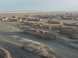 Yadan National Geopark near Dunhuang, Gansu, China, features dramatic wind-eroded rock formations rising from the Gobi Desert. A striking landscape along the ancient Silk Road. © JEREMIE