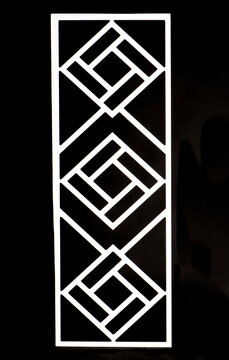 White Geometric Decorative Lattice Panel on Black Background