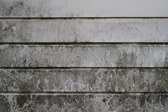 Weathered metal texture with heavy dark grime and staining on horizontal panels