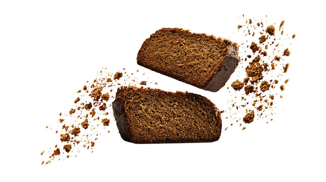 Isolated two slices of dark rye bread with crumbs floating, rich texture and rustic look, healthy food