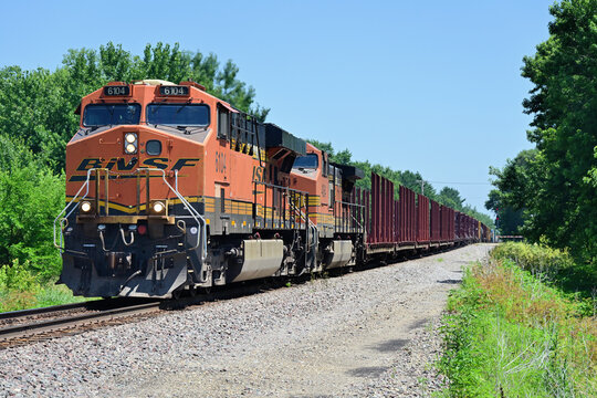A pair of locomotives lead an eastbound Burlington Northern Santa Fe freight train as it passes through rural north central Illinois.