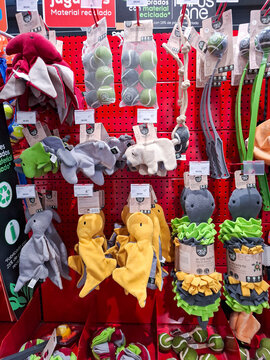 Denia, Spain - October 10, 2025. Red pegboard display wall shows eco friendly dog toys in Spain