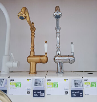 Denia, Spain - October 10, 2025. Classic bronze and chrome Delinia Sara vintage style kitchen faucets shown in a retail store in Spain