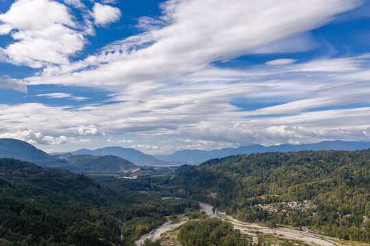 Scenic Valley And River Through Forested Mountains Under Dramatic Clouds Near Chilliwack, BC, Canada