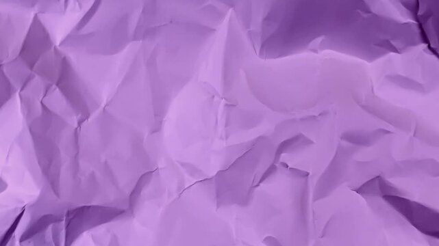Purple crumpled paper tearing transition revealing green screen background with copy space