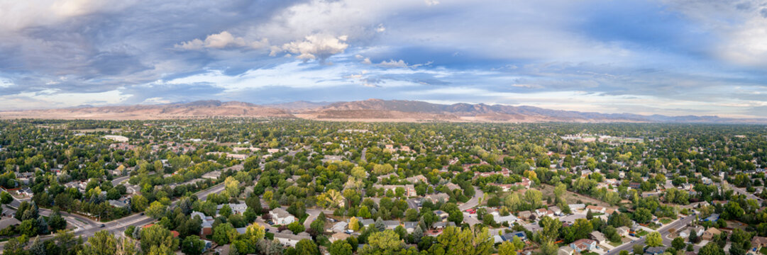late summer morning over city of Fort Collins and Front Range of Rocky Mountains in northern Colorado, aerial panorama