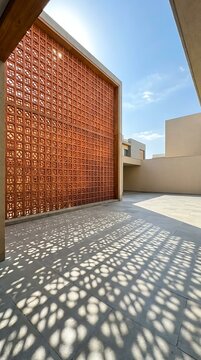 Terracotta Brick Perforated Screen Wall With Geometric Shadows