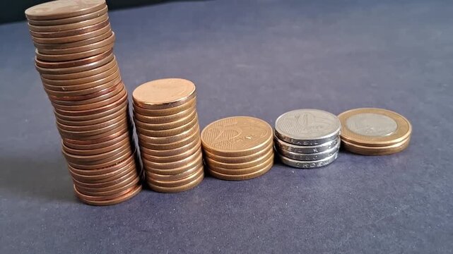 Stacked metallic coins showing decreasing growth