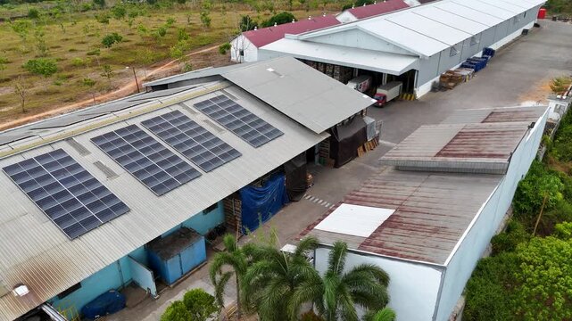 Industrial warehouse facility with solar power panels installed on the roof in South Kalimantan