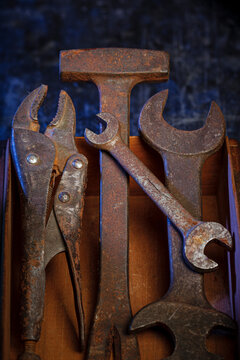 Vintage Rusty Tools in Antique Wooden Toolbox Flat Lay Concept