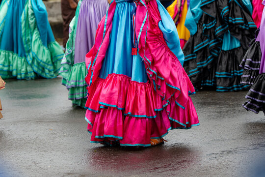 Costa rican folk dancers performing in colorful traditional costumes