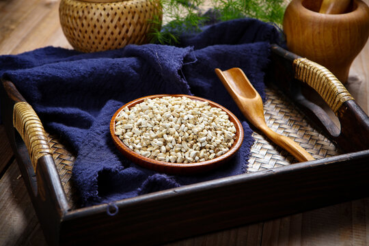 Dried Safflower Seeds in Wooden Bowl Herbal Tea Scene