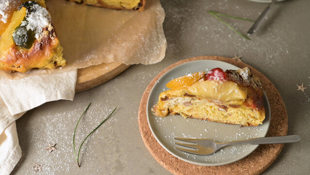 Traditional Portuguese Bolo Rei or King cake slice with candied fruit and nuts