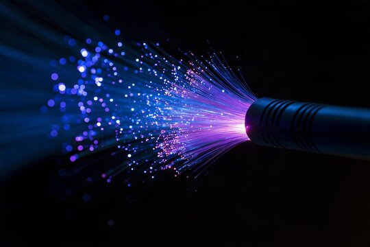 Fiber optic cable emitting glowing blue and purple light beams in dark space