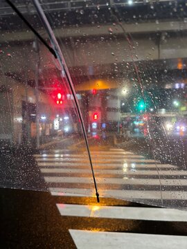 Night time in Japan with rain and bokeh traffic lights