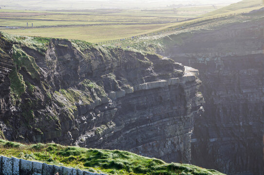Scenic steep cliffs view at Cliffs of Moher in County Clare, Ireland