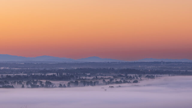 Morning Fog and Sunrise Over Pitt River Valley, BC Canada, and Cascade Mountains, Washington USA