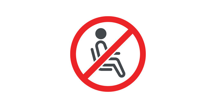 No sitting allowed red circular sign for public spaces.