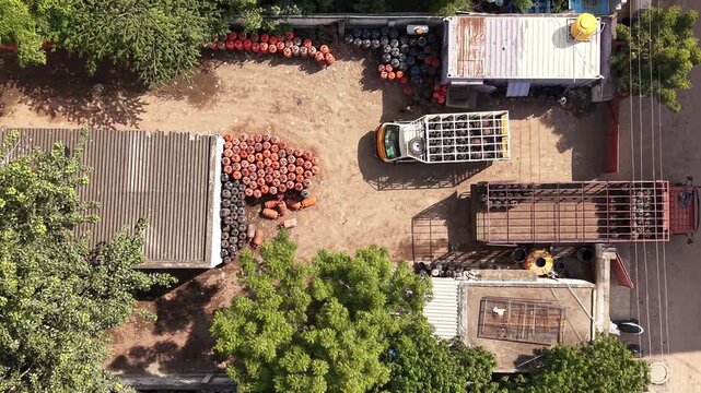 LPG cooking gas cylinder godown with loading truck aerial gas distribution storage