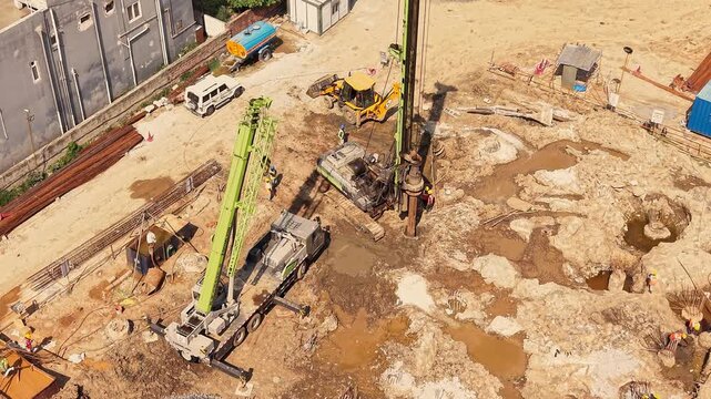 Ground drilling rig working on cleared construction land foundation work development