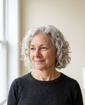 Confident older woman with silver curls and natural beauty
