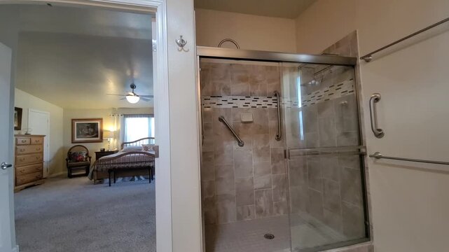 Interior View: Glass Shower in Beige Tile Suite