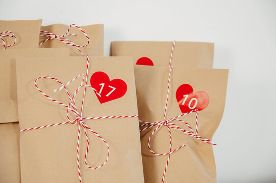 closeup photo of handmade advent calendar bags with numbers . Winter holidays gift ideas. Christmas countdown