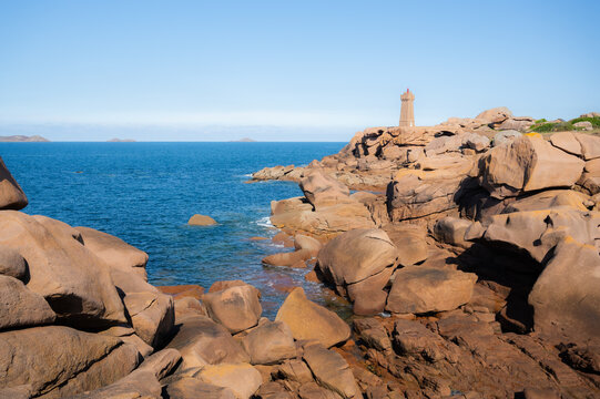 Landscape with Phare Mean Ruz Lighthouse on a sunny day. landmarks in Ploumanach, Brittany, France. travel destination.copy space banner